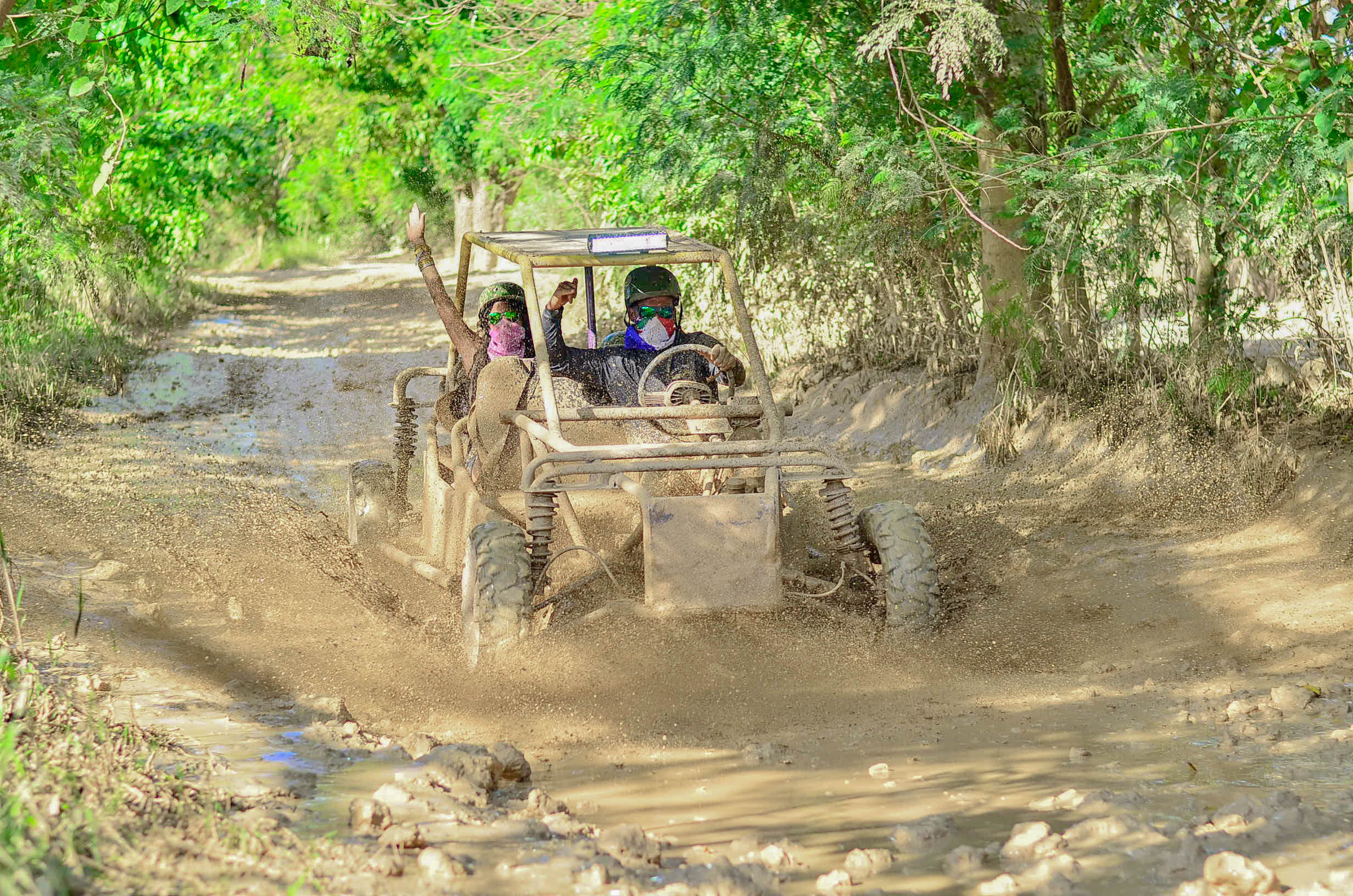 Buggy driving through a muddy trail in Punta Cana